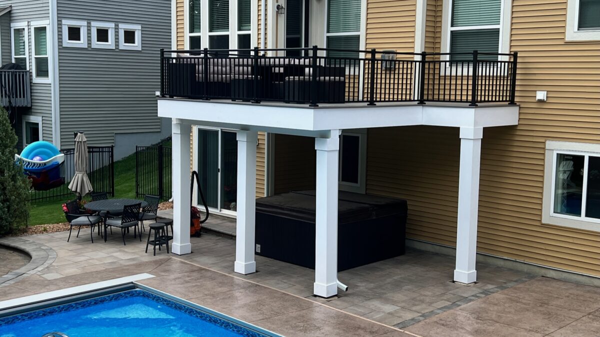 Composite deck next to an in-ground pool