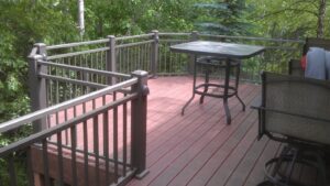 An updated deck with realistic looking composite decking and aluminum railing.