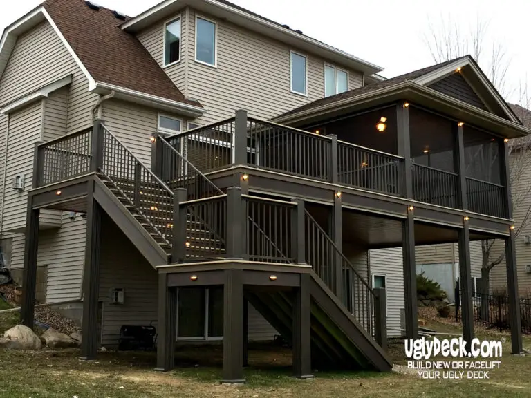 A two-story house with a large, elevated deck features stairs, railings, and built-in lights. This custom deck install includes a screened-in section and dark wood materials. The uglydeck.com logo appears in the lower right corner.