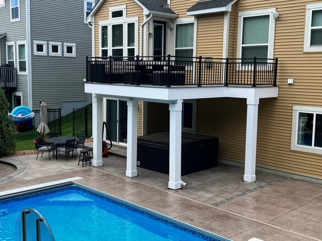 Composite deck next to an in-ground pool