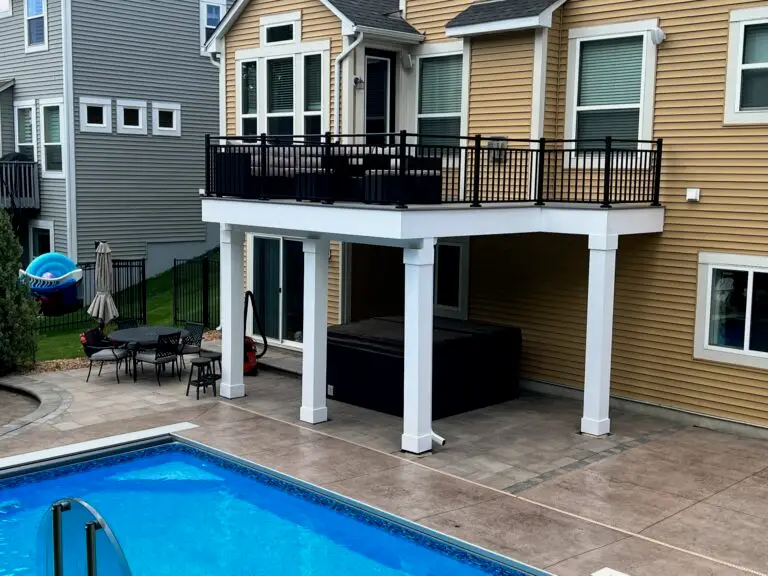 Composite deck next to an in-ground pool